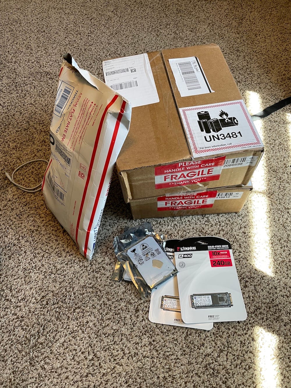 A pile of packages with various computer parts