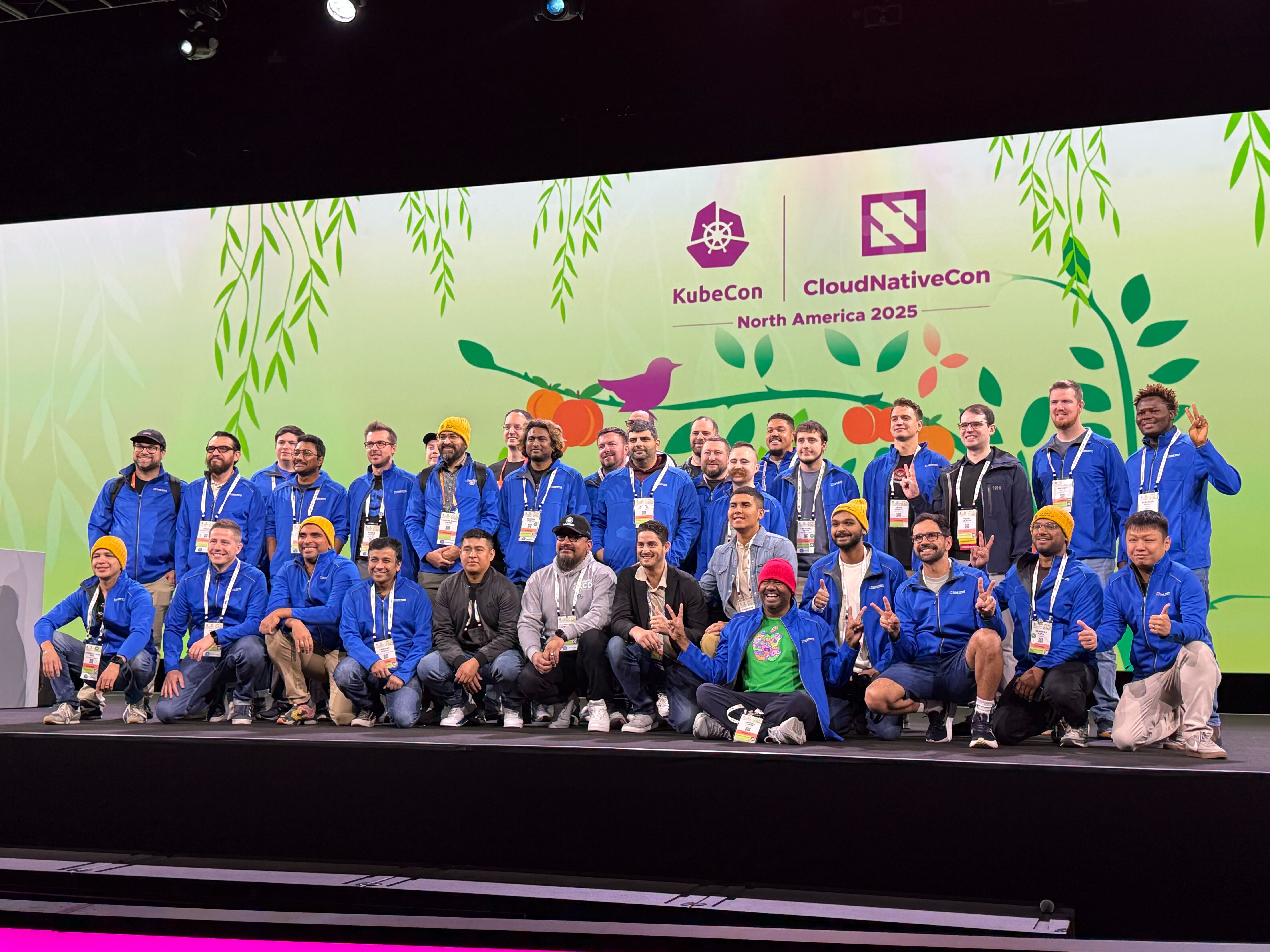 The KubeCon 2025 stage full of people wearing Kubestronaut gear.