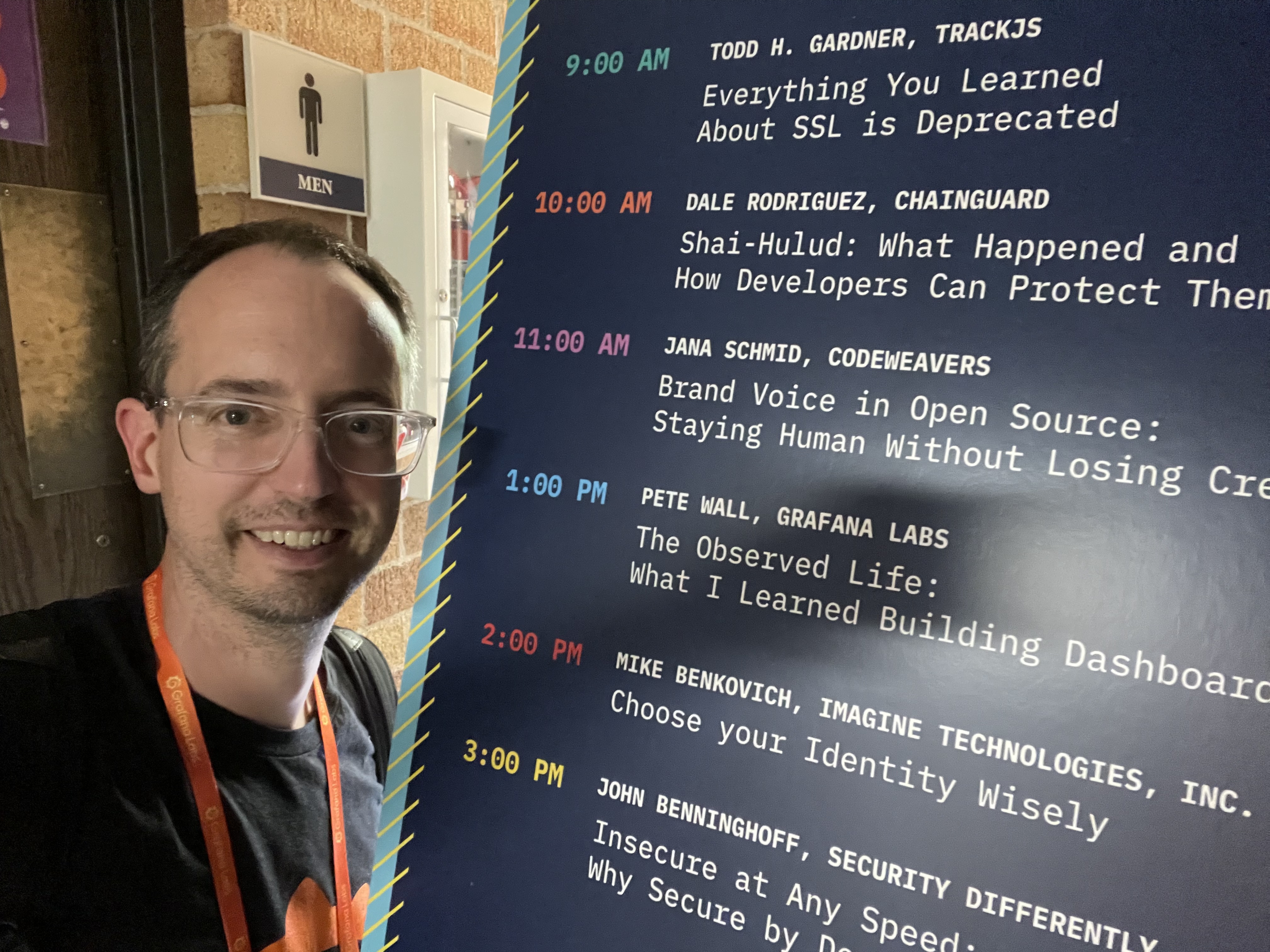 Me next to the schedule board showing my talk, &ldquo;The Observed Life,&rdquo; at 1:00 PM