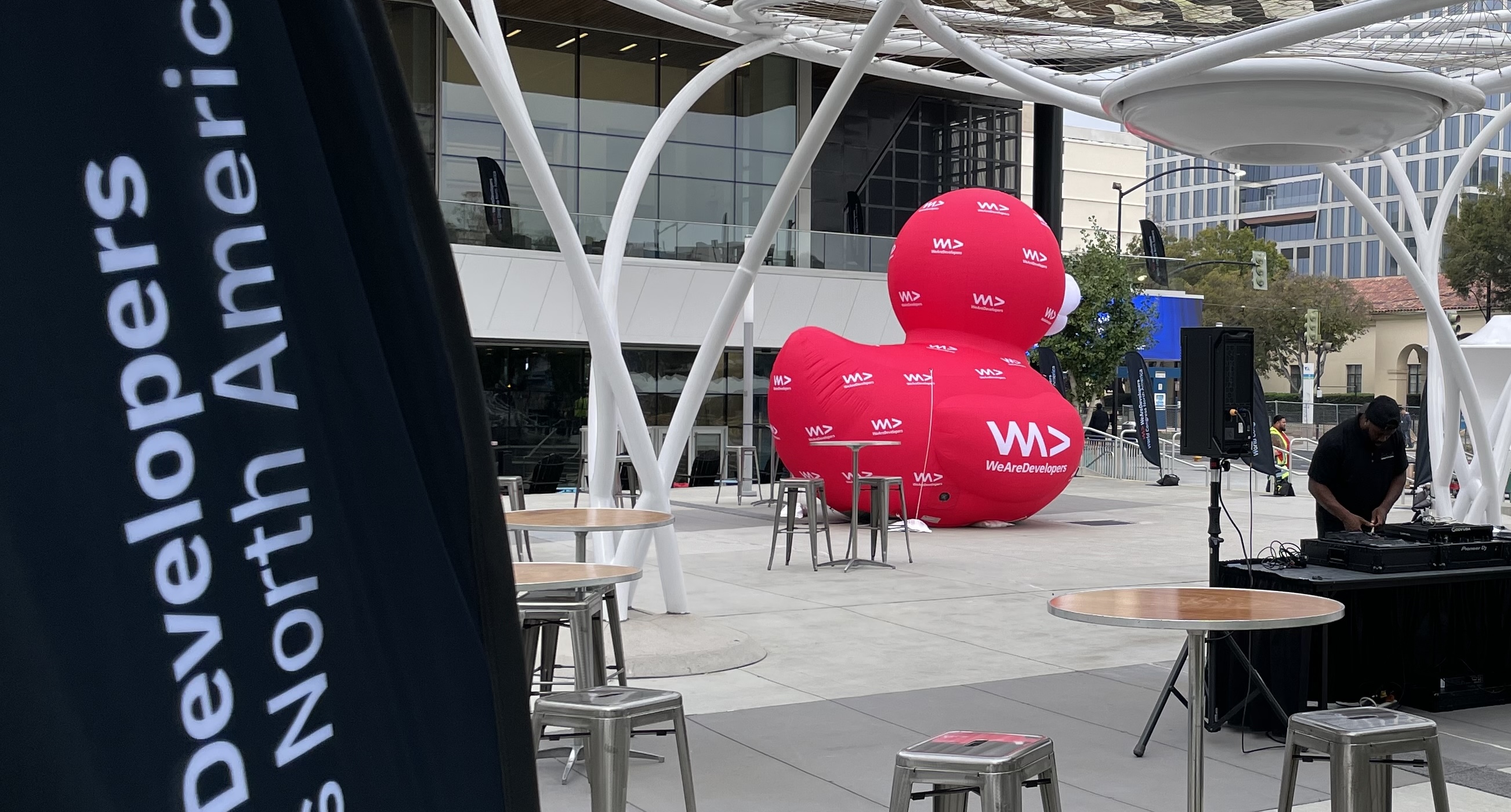 The outdoor stage at WeAreDevelopers World Congress North America 2026, with conference logos on a large, red, inflatable "rubber" duck.